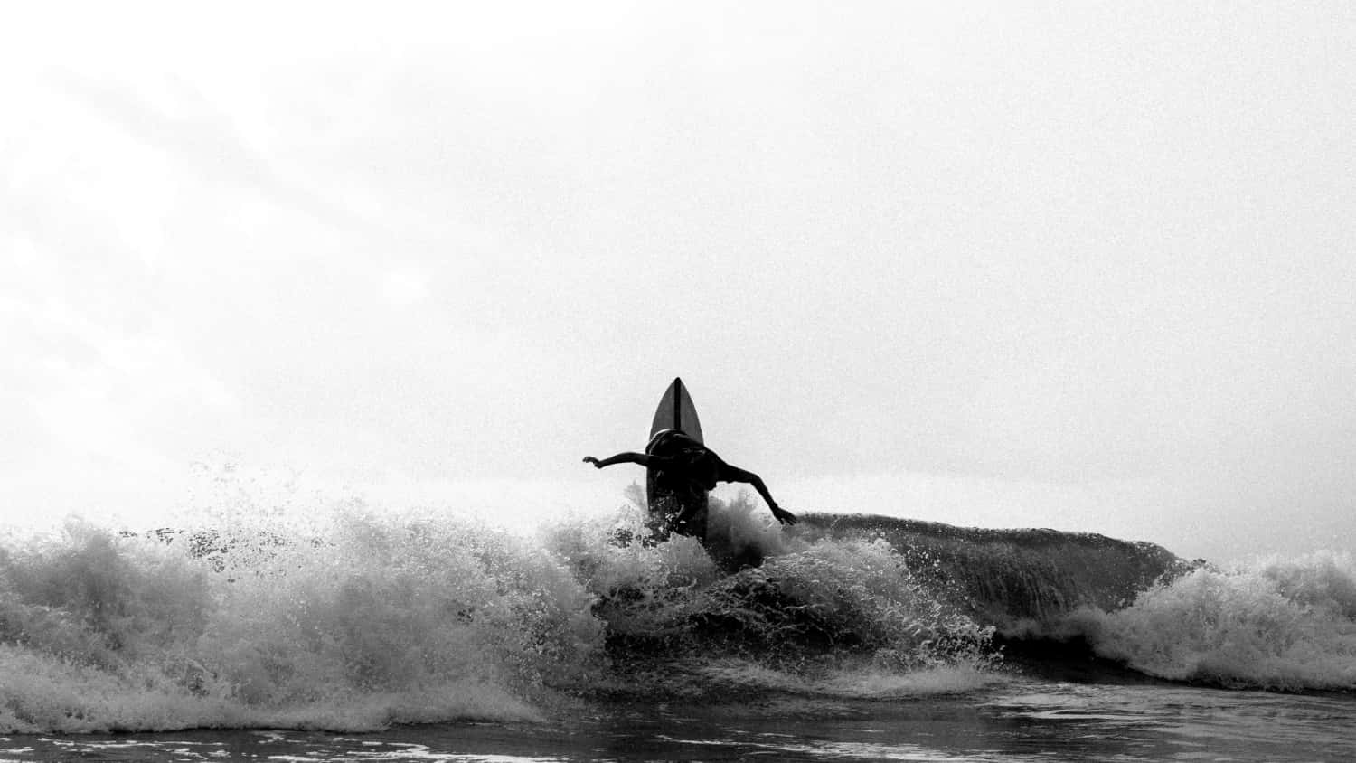 Surfer catching a wave in North Palm Beach on a weekday